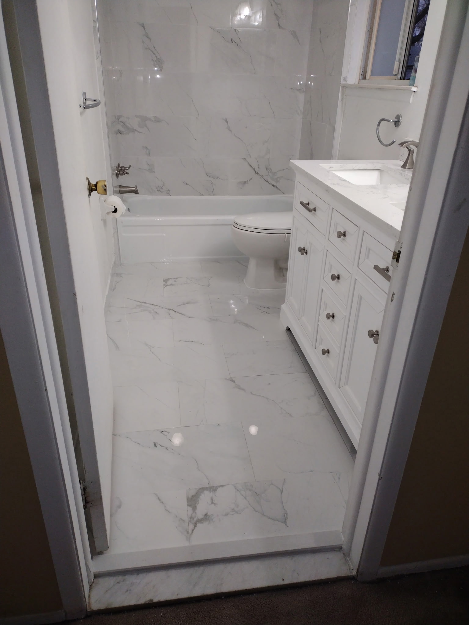 Completed bathroom renovation with modern fixtures