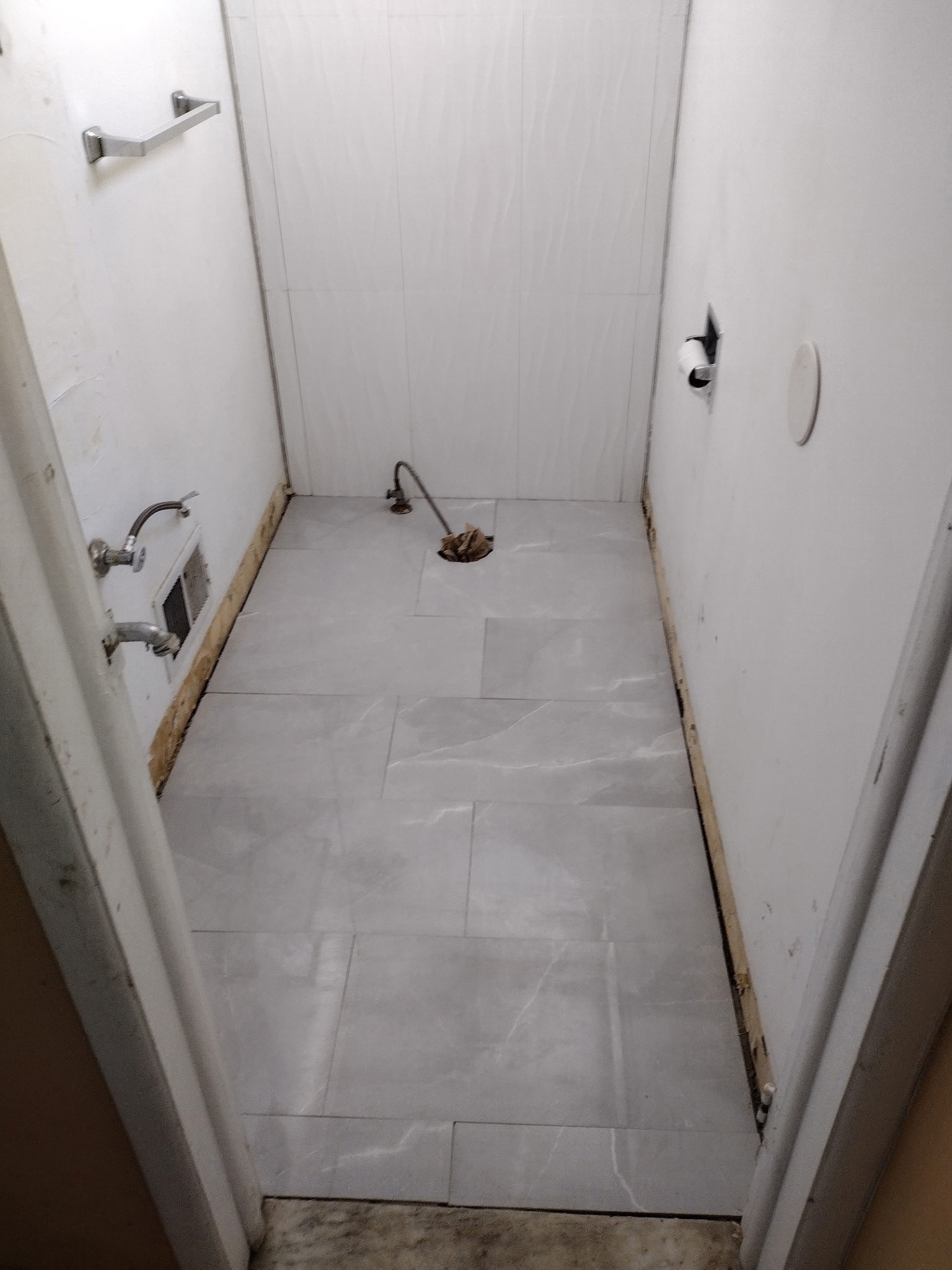 Laying new flooring in half-bathroom